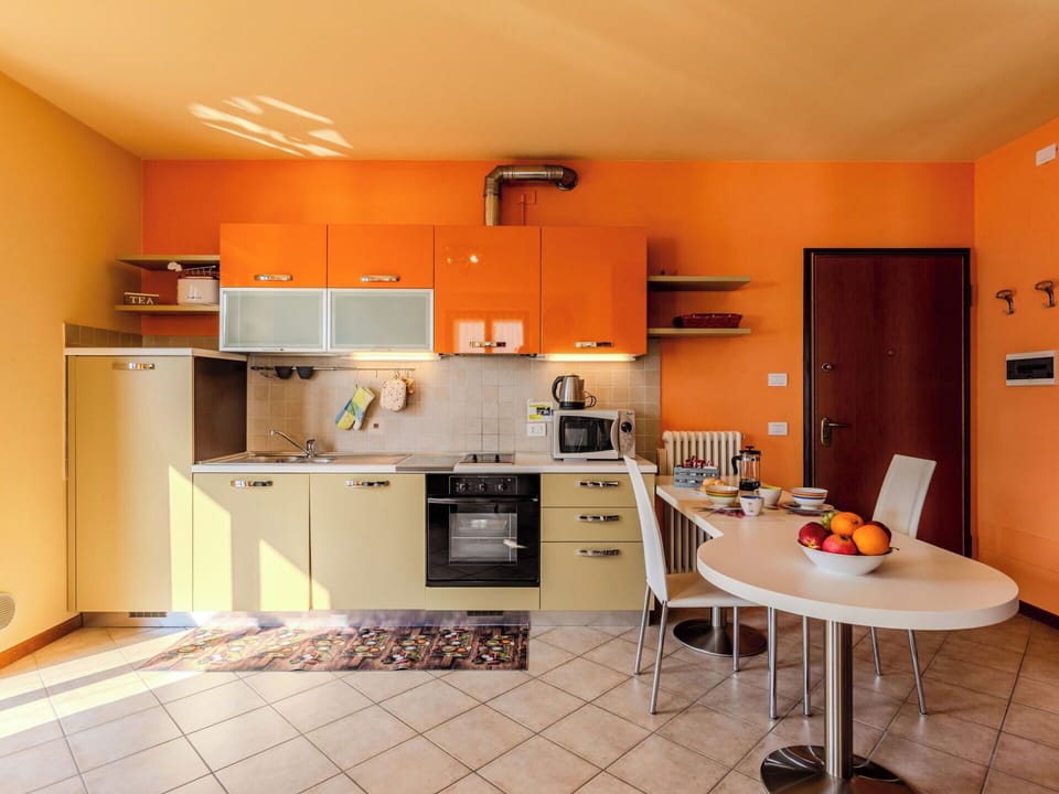 Interior Design, Furniture, Kitchen, Flooring, Wood, Room, Ceiling, Countertop, Orange, Floor
