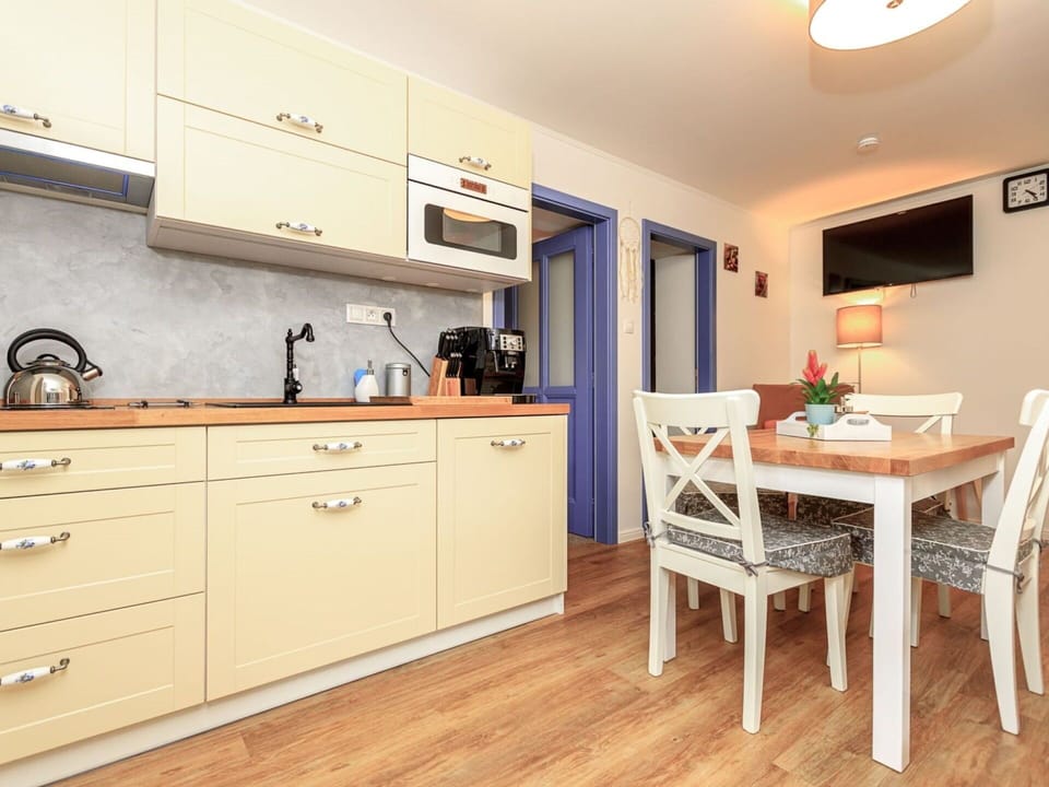 Cabinetry, Furniture, Property, Sink, Chair, Countertop, Building, Table, Lighting, Wood