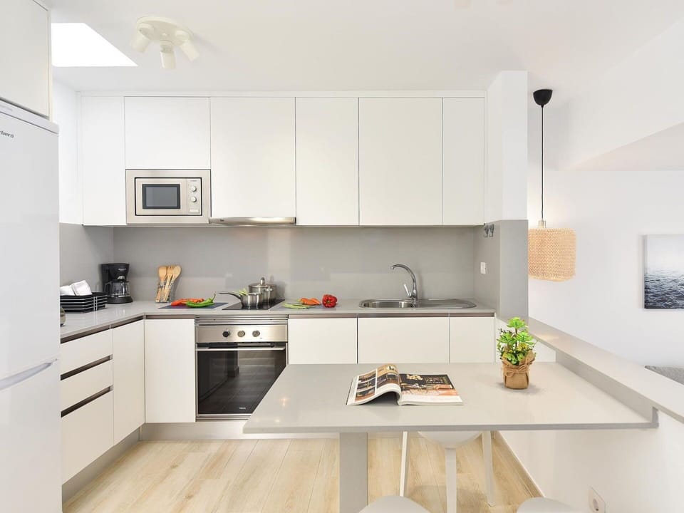 Cabinetry, Countertop, Sink, Kitchen Stove, Kitchen, Wood, Interior Design, Flooring, Home Appliance