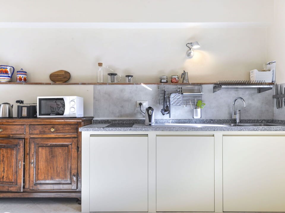 Kitchen Sink, Cabinetry, Countertop, Sink, Kitchen Appliance, Kitchen Stove, Home Appliance, Kitchen, Interior Design, Lighting