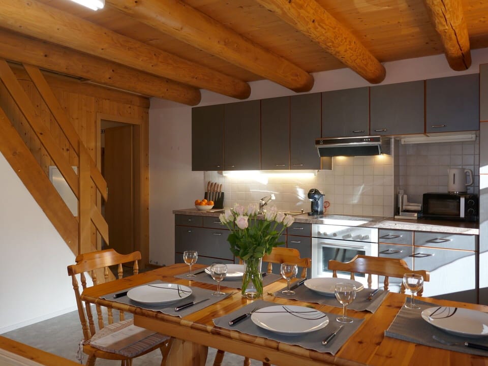Property, Table, Furniture, Cabinetry, Wood, Interior Design, Countertop, Lighting, Flooring, Chair