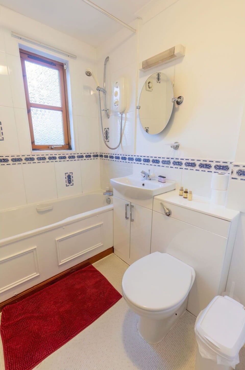 Property, Sink, Plumbing Fixture, Mirror, Bathroom Sink, Window, Bathroom, Purple, Tap, Lighting
