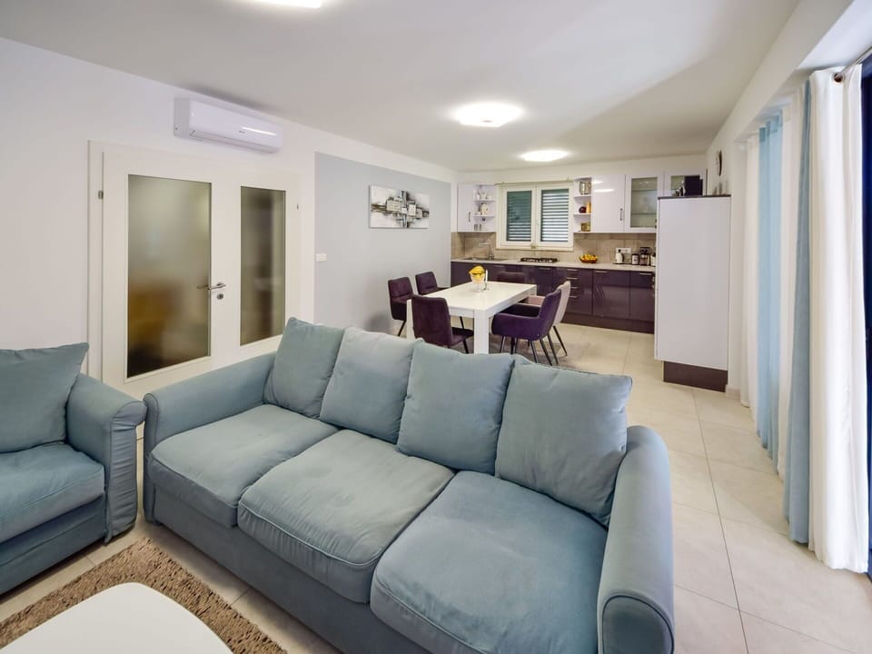 Couch, Furniture, Property, Picture Frame, Building, Azure, Table, Lighting, Interior Design, Architecture