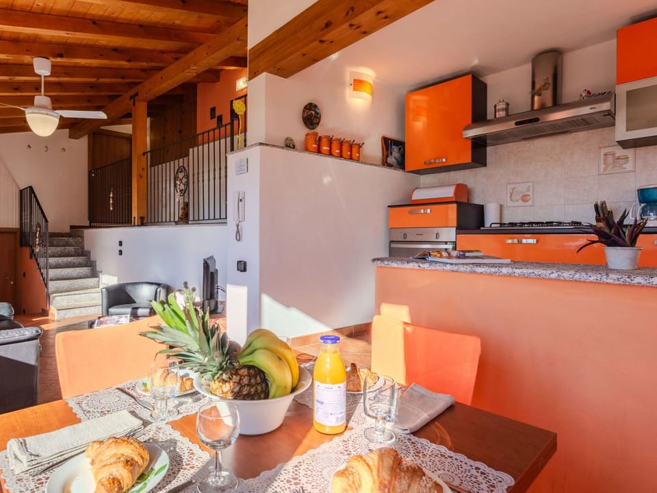 Food, Table, Furniture, Property, Tableware, Couch, Cabinetry, Countertop, Orange, Interior Design