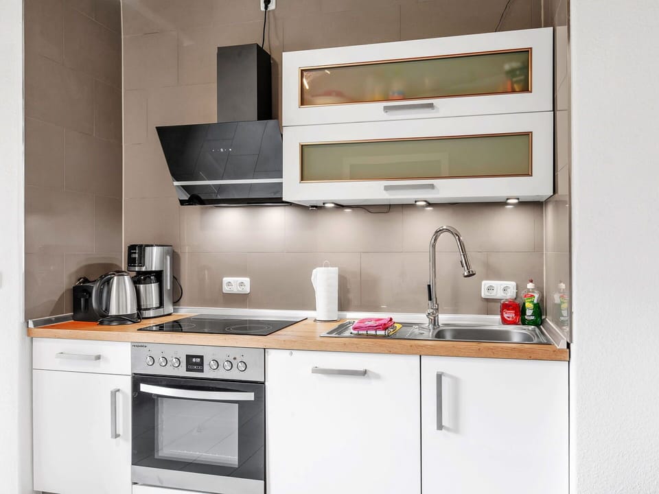 Cabinetry, Countertop, Property, Kitchen Sink, Kitchen Stove, Sink, Kitchen, Kitchen Appliance, Building, Home Appliance