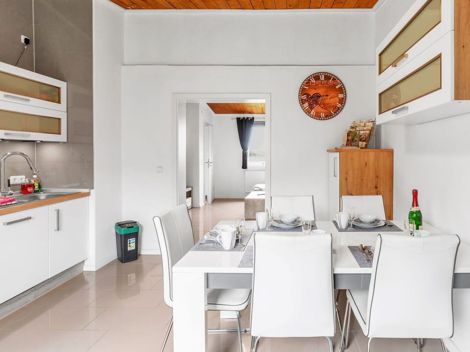 Furniture, Building, Cabinetry, Table, Interior Design, Lighting, Kitchen, Architecture, Countertop, Floor