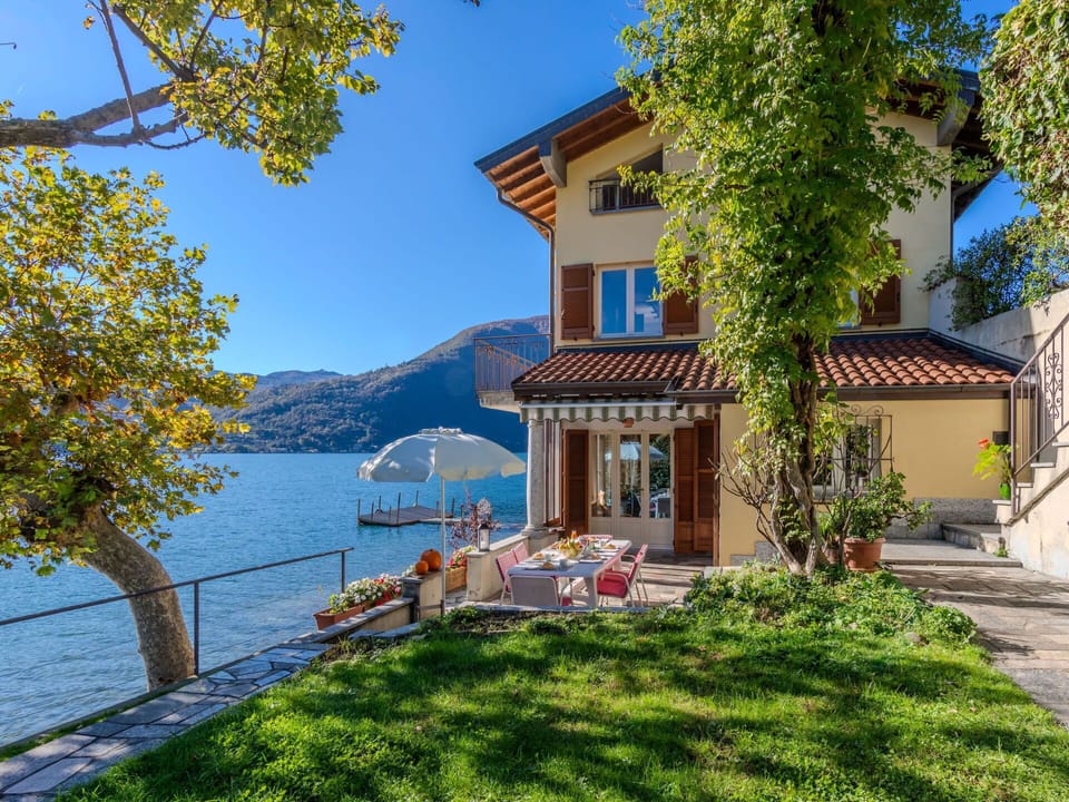 Water, Building, Plant, Sky, Window, Azure, House, Vegetation, Cottage, Sunlight