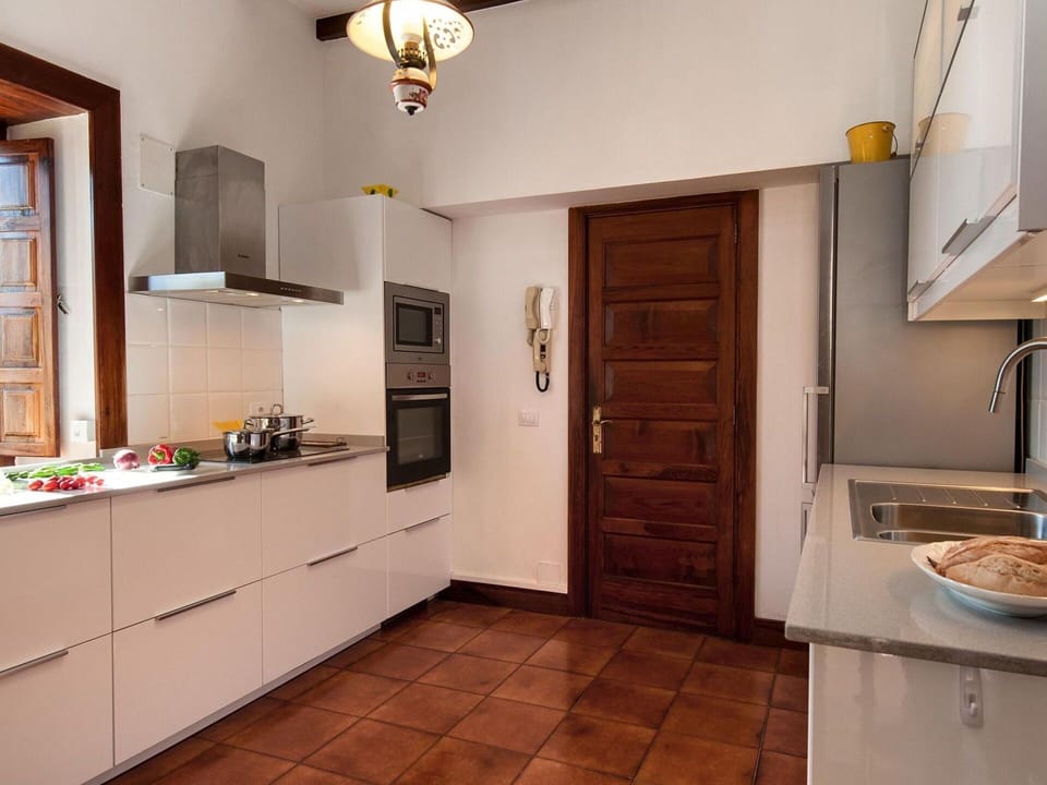 Cabinetry, Countertop, Property, Furniture, Wood, Lighting, Kitchen, Interior Design, Flooring, Floor