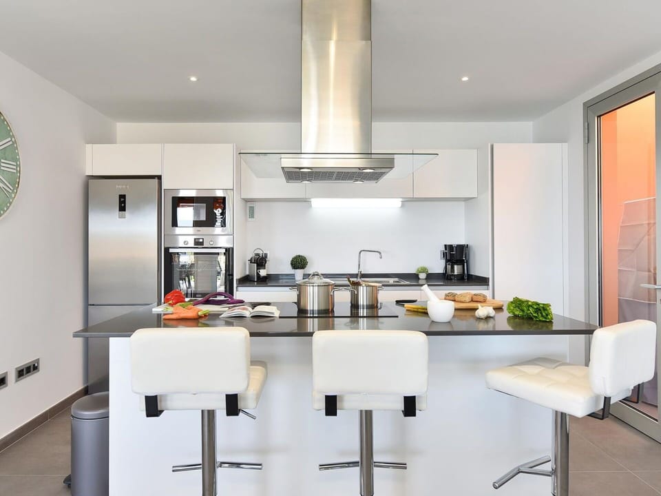 Countertop, Cabinetry, Furniture, Kitchen Stove, Kitchen Appliance, Kitchen, Home Appliance, Flooring, Interior Design, Chair