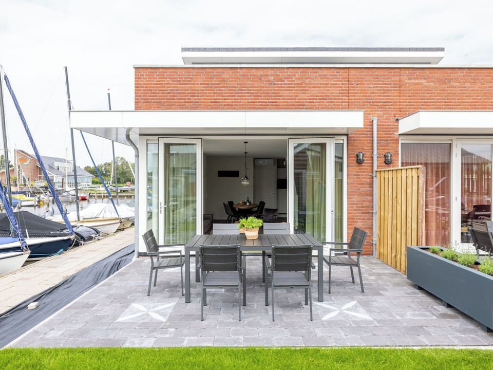 Furniture, Home, Door, Floor, Chair, Outdoor Furniture, Patio, Outdoor Table, Houseplant, Kitchen & Dining Room Table