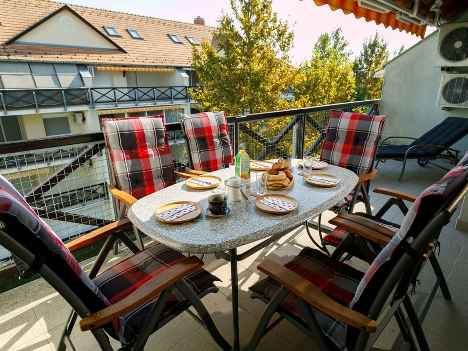 Table, Furniture, Tableware, Chair, Outdoor Table, Building, Outdoor Furniture, House, Wood, Interior Design