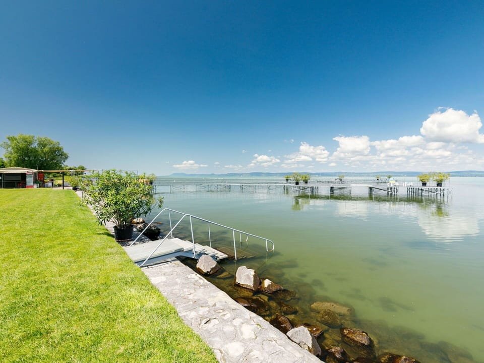 Water, Sky, Cloud, Plant, Lake, Coastal And Oceanic Landforms, Tree, Bank, Dock, Horizon