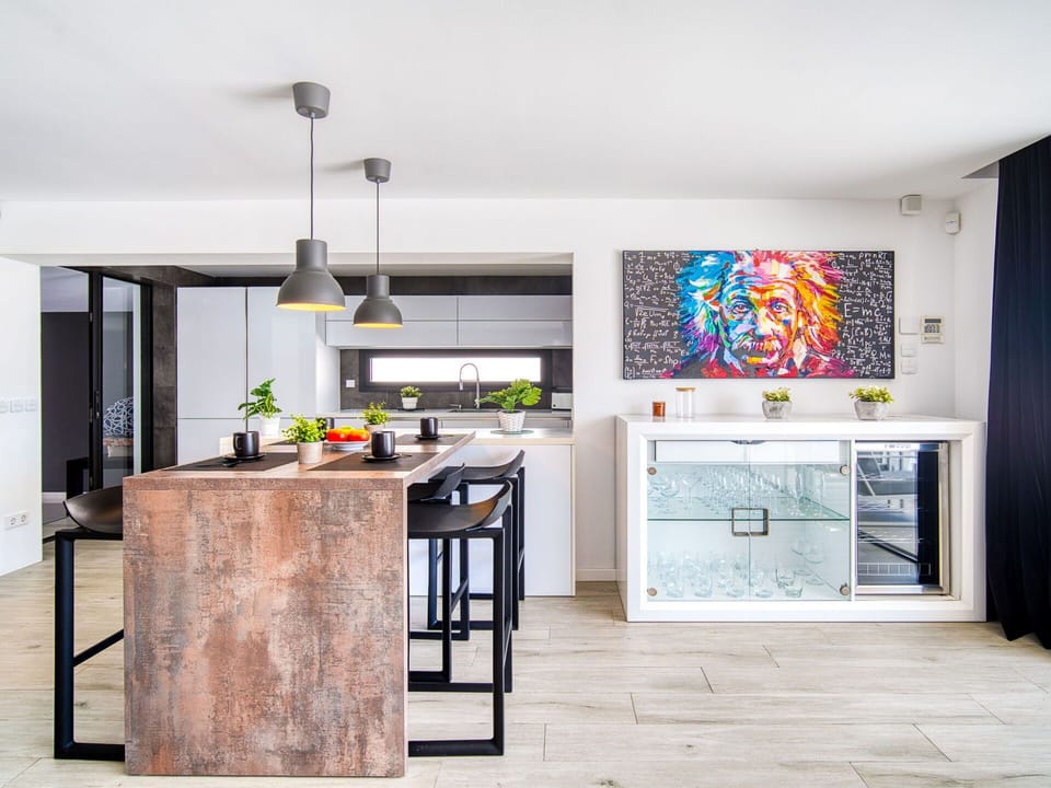 Furniture, Interior Design, Kitchen, Flooring, Countertop, Floor, Wall, Wood, Light Fixture, Table