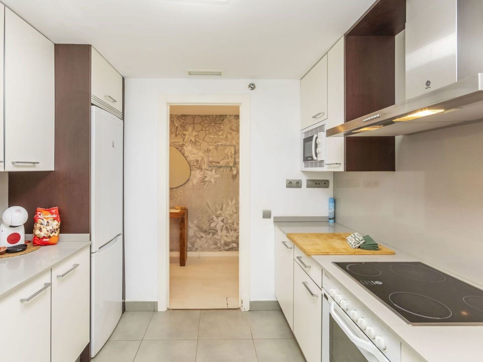 Countertop, Kitchen, Kitchen Appliance, Flooring, Interior Design, Major Appliance, Cabinetry, Furniture, Wood, Floor