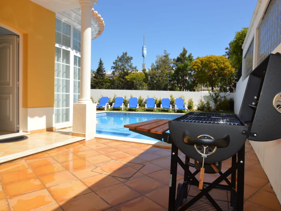 Water, Plant, Sky, Property, Swimming Pool, Azure, Outdoor Furniture, Shade, House, Tree