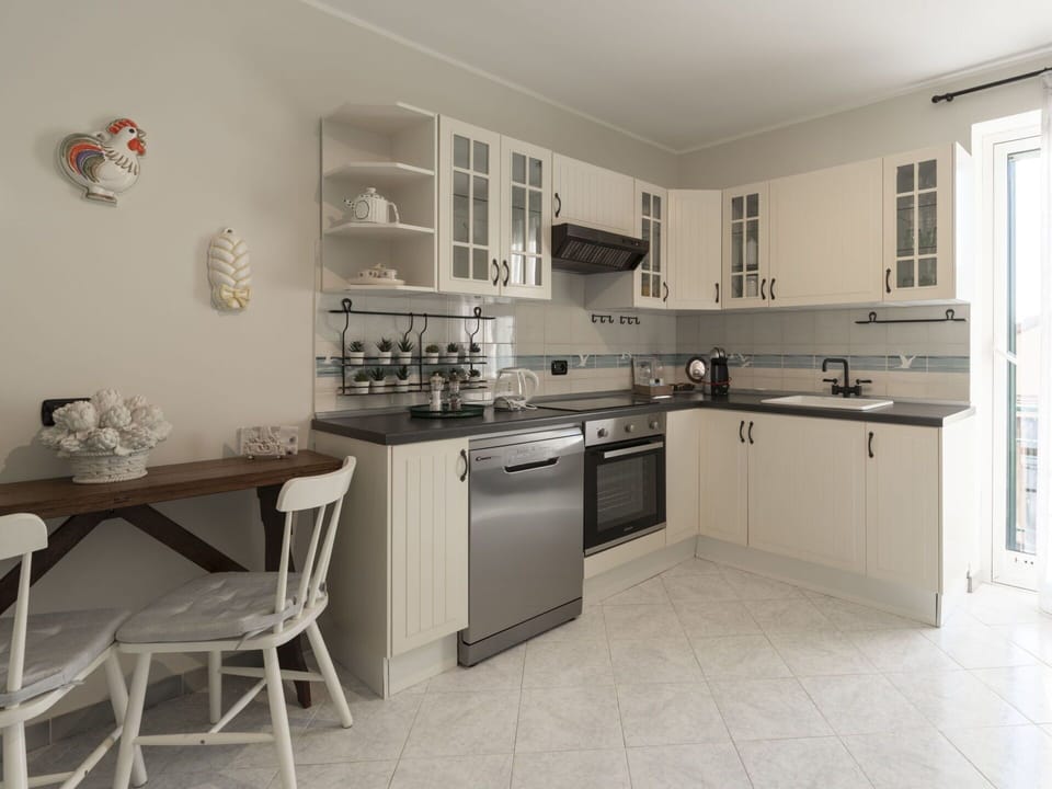 Cabinetry, Furniture, Countertop, Property, Building, Kitchen Stove, Kitchen, Window, Interior Design, Kitchen Appliance