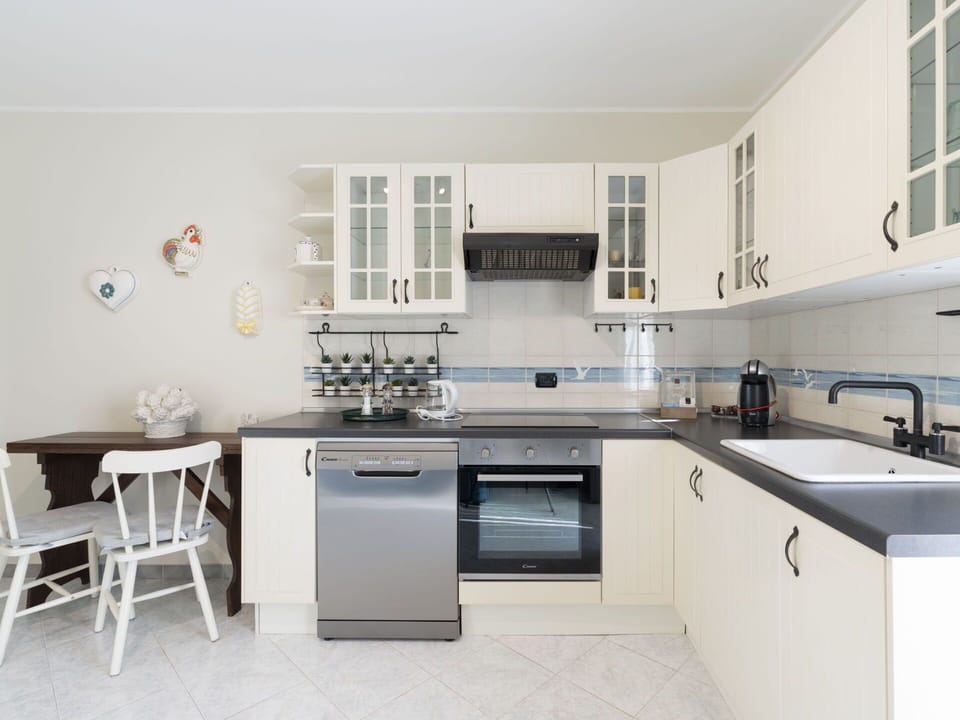Cabinetry, Kitchen Sink, Sink, Tap, Furniture, Countertop, Kitchen Stove, Plumbing Fixture, Kitchen, Interior Design