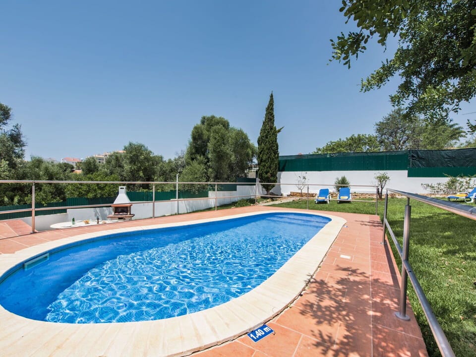 Water, Sky, Plant, Swimming Pool, Azure, Tree, Shade, Leisure, Composite Material, Real Estate