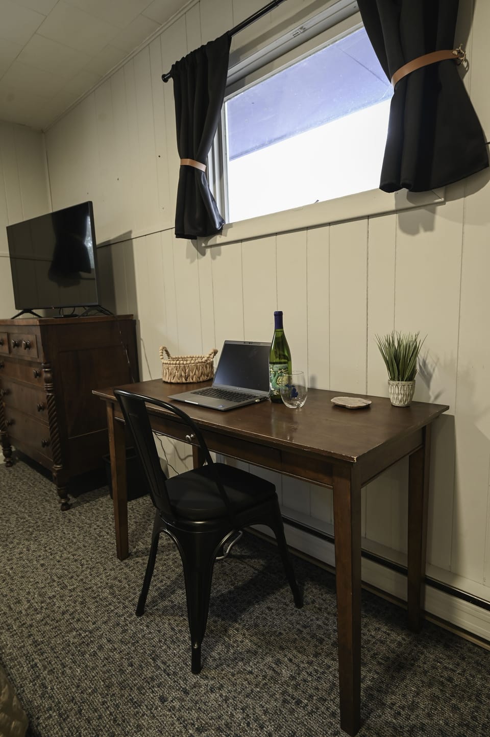 1st bedroom has a desk set up as a private designated work station. 
