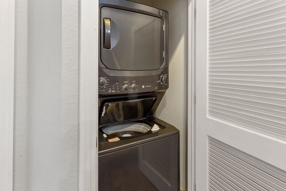 A stackable Washer & Dryer ensures clean clothes for the family all week.