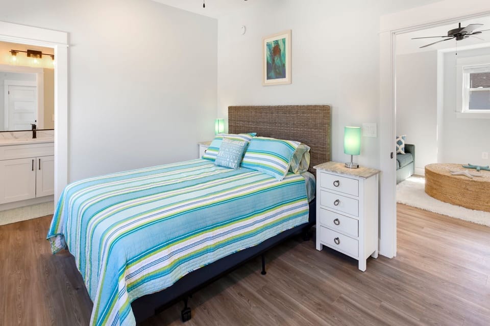 A comfortable Bedroom with a Bathroom and Flat Screen TV offers even more space to relax after a long day at the beach!
