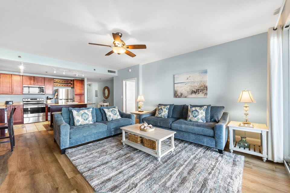 Cozy Living Room with Lake Views, New Flooring, Sleeper Sofa, Flat Screen TV and Private Balcony Access