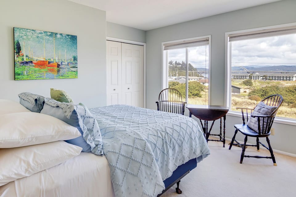 This bedroom has a view of the Alsea Bay Bridge.