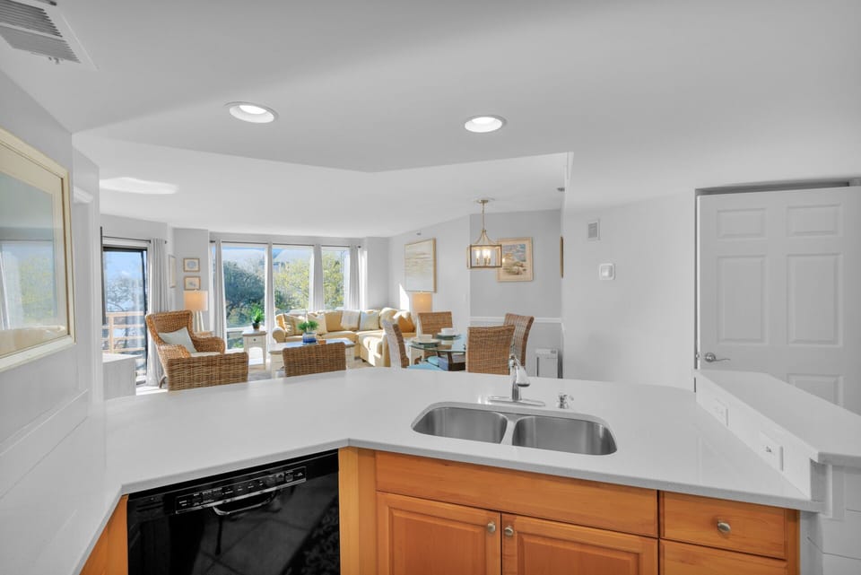 Fully stocked kitchen with 2 barstools.