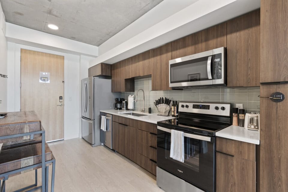 Experience the convenience of a well-equipped kitchen with pots, pans, bakeware, salt + pepper, and olive oil.
