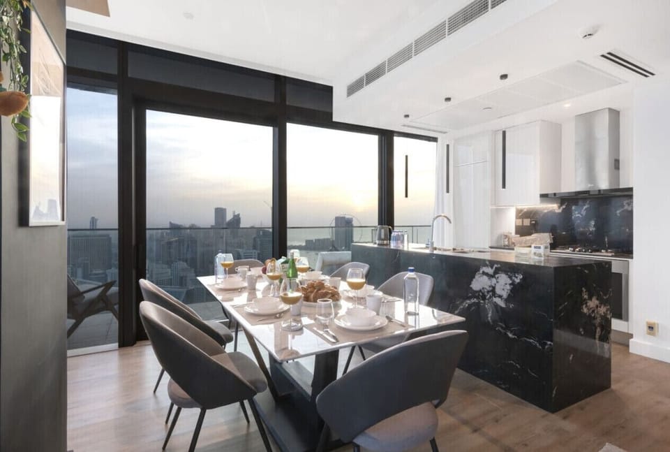 Dining Room: Spectacular skyline views set the stage for unforgettable meals with a modern flair!