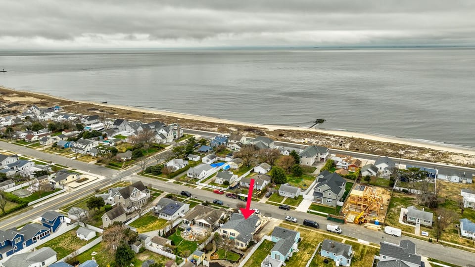 Aerial view of the home showing it's close proximity to the bay beach.