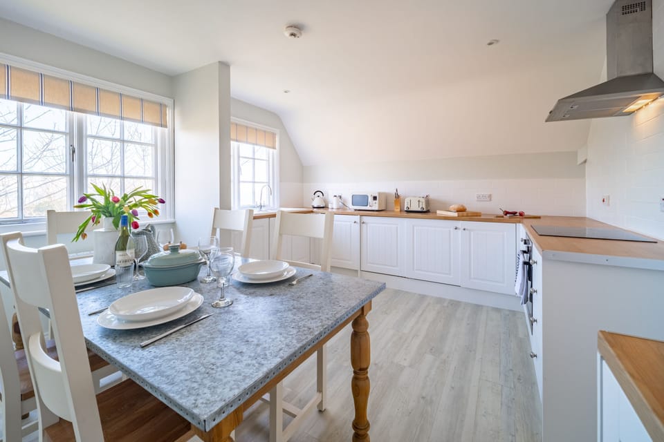 The spacious kitchen has dining space for six people