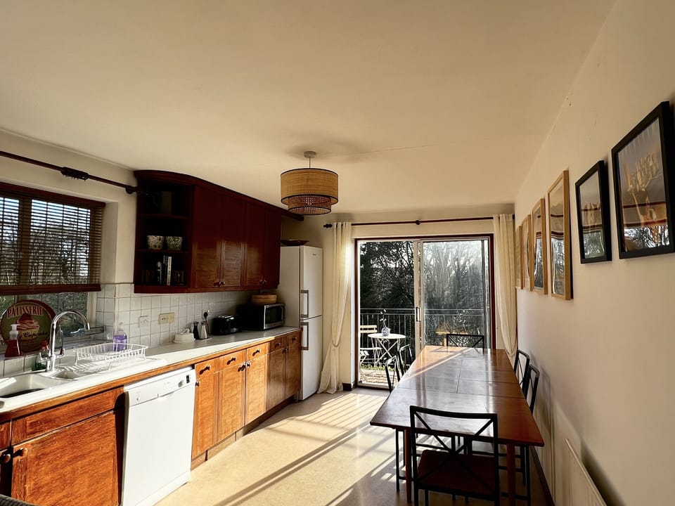 Kitchen is well equipped and leads onto the balcony.