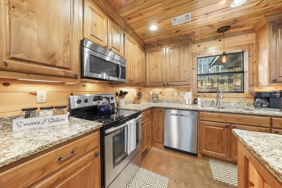 You’ll find plenty of prep space on the countertops, along with all the cookware, bakeware, dishware, flatware, glassware, serving-ware, and utensils you need to prepare and serve your favorite meals – plus a s’mores station.