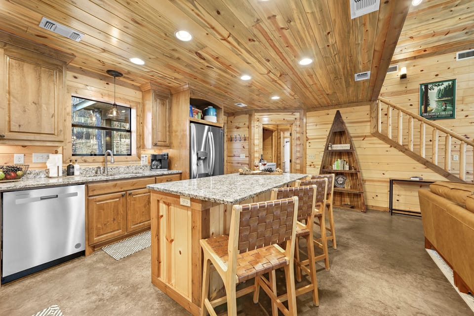 At mealtime, prep and cook in the fully equipped kitchen with all the standard major appliances — refrigerator, stove/oven, microwave, and dishwasher.