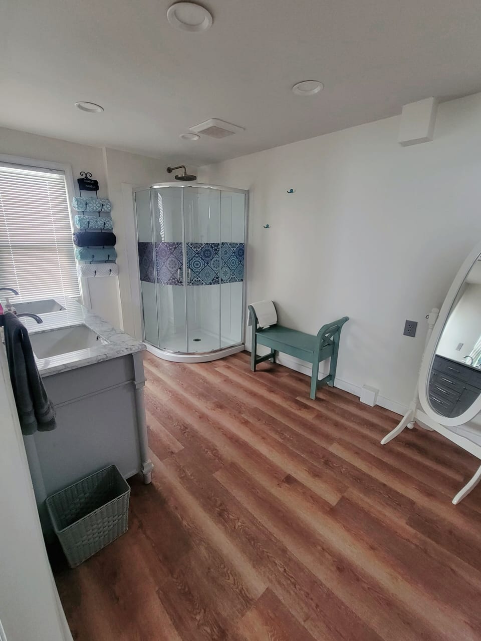 Huge bathroom with a rain shower head stand-up shower and new double sink.