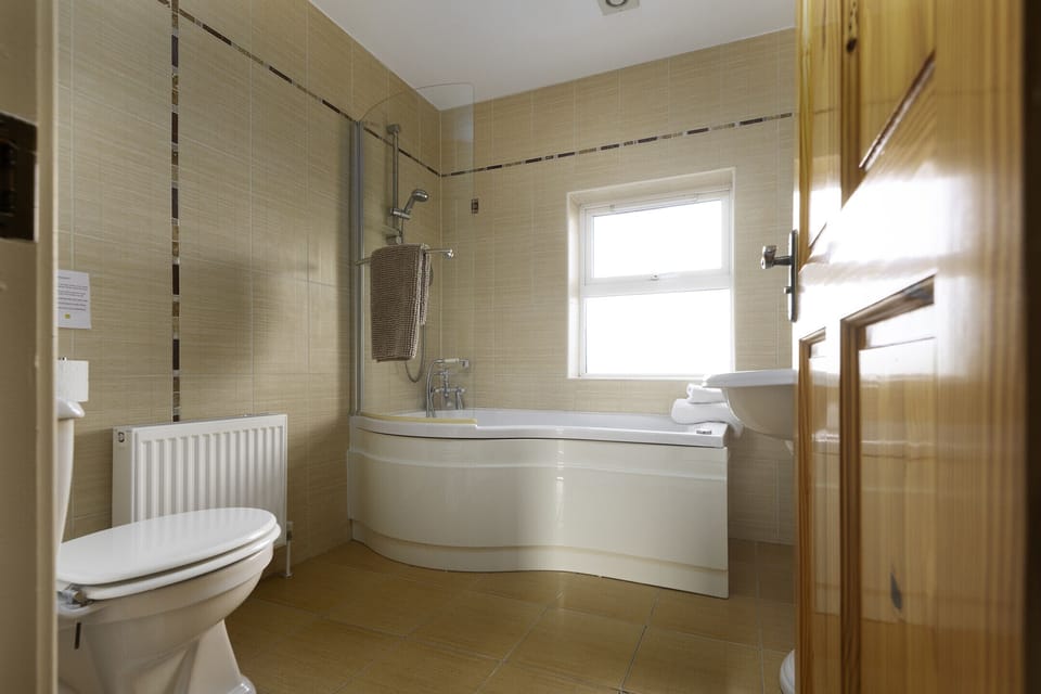 Bathroom with bath and shower  Rhea Holiday Home Bantry County Cork Ireland
