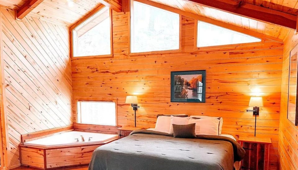 Retreat to the bedroom featuring a comfortable king-sized bed and large windows that lets in natural light. Enjoy a relaxing soak in the in-room jetted tub, perfect for unwinding after a day i
