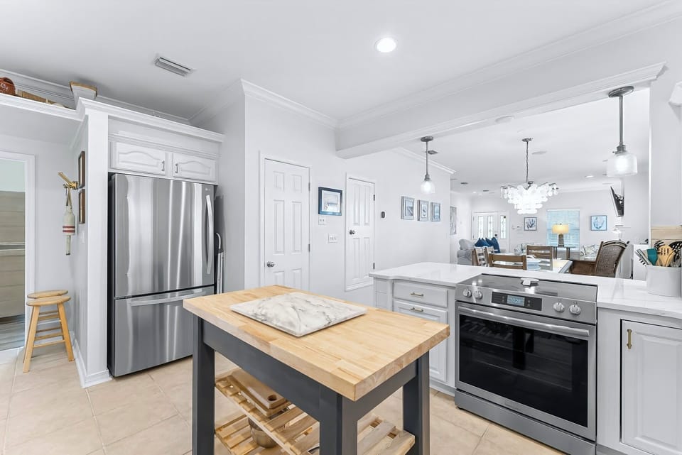 Fully stocked kitchen with stainless steel appliances 