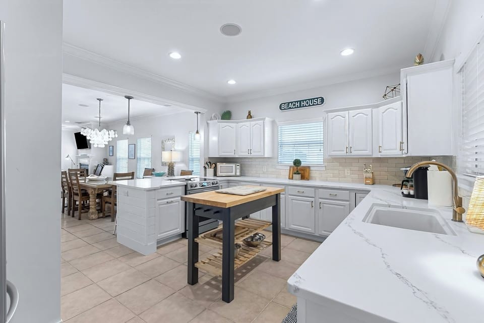 Fully stocked kitchen with butcher block island 