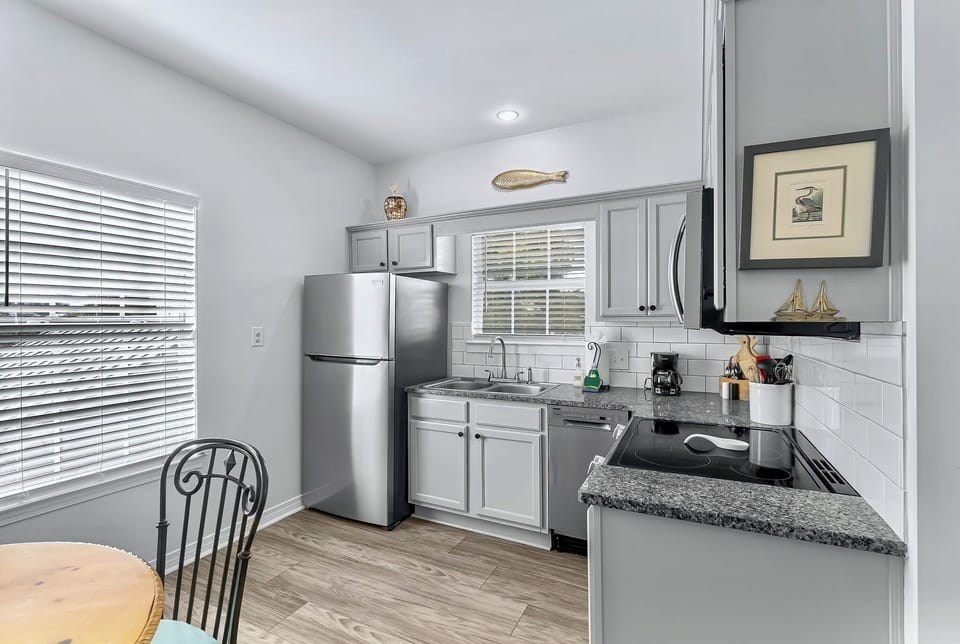 Carriage house kitchen with stainless steel appliances 