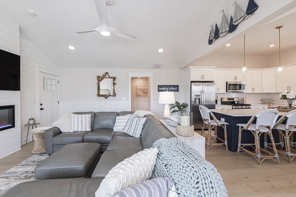 Bright Coastal Living Room with Vaulted Ceilings