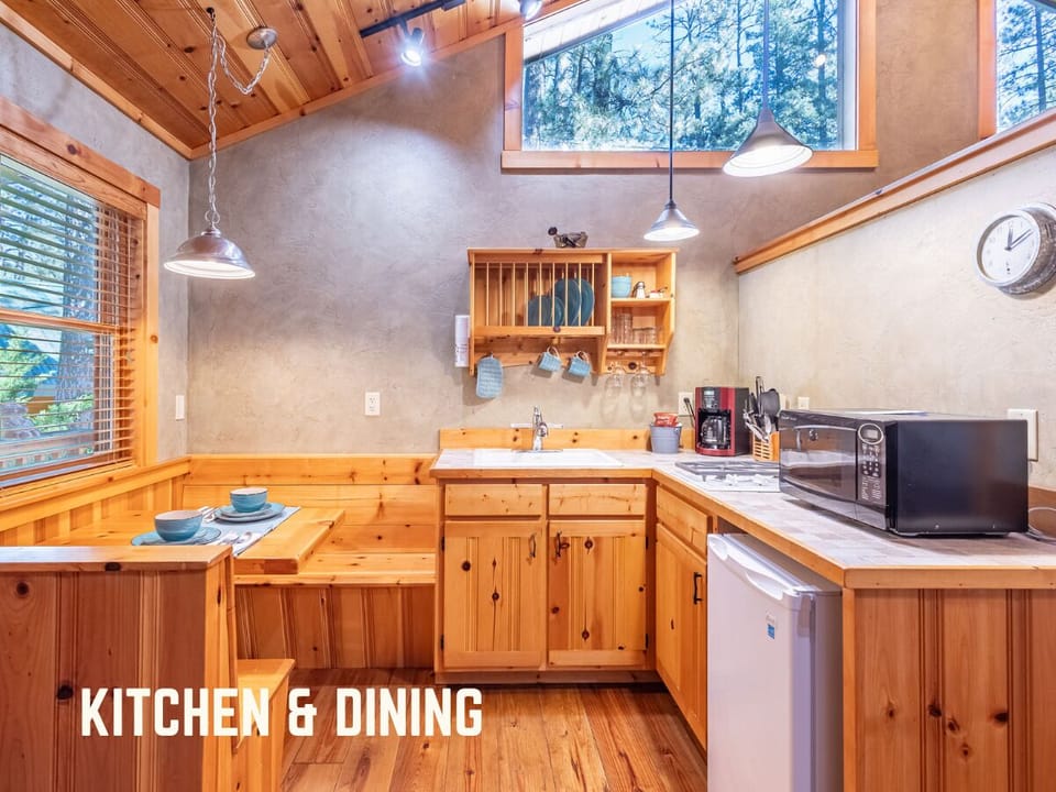 Enjoy meals in this charming kitchen and dining area, where the natural light fills the space, creating a warm and inviting atmosphere. The cozy built-in dining nook is perfect for intimate me
