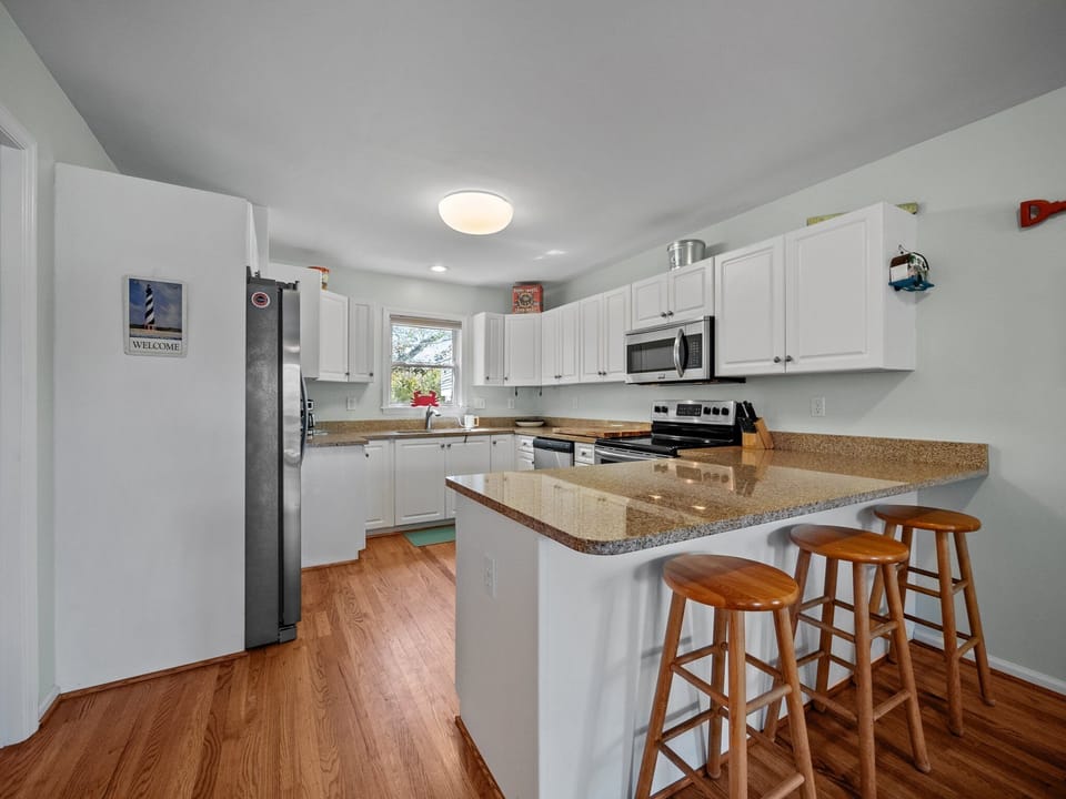 Spacious kitchen with additional bar seating