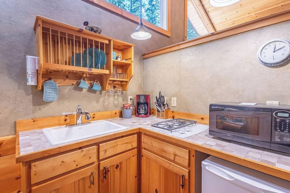 A kitchen so clean, it sparkles like a beacon of culinary perfection.