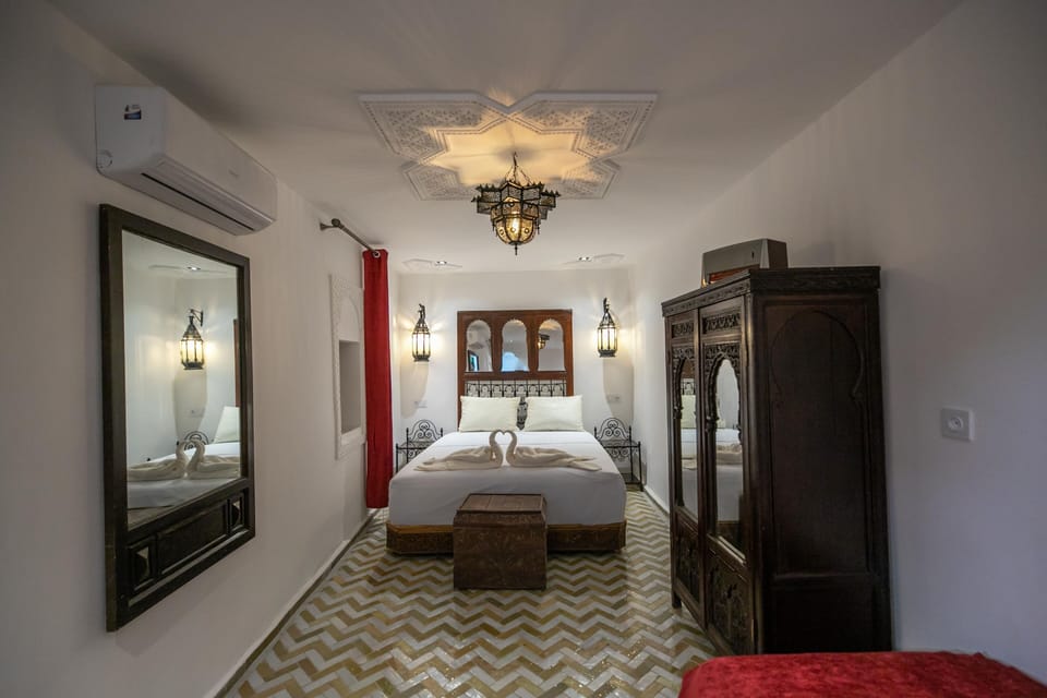 Deluxe Triple Room, Courtyard View | In-room safe, WiFi (free)