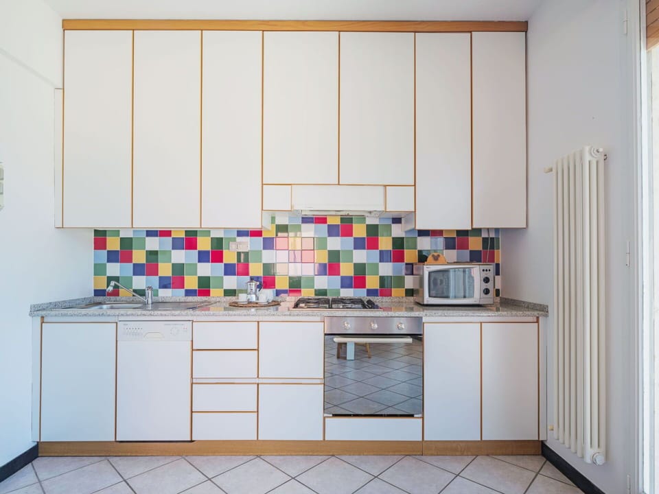 Cabinetry, Building, Kitchen, Flooring, Kitchen Appliance, Countertop, Floor, House, Kitchen Stove, Wood