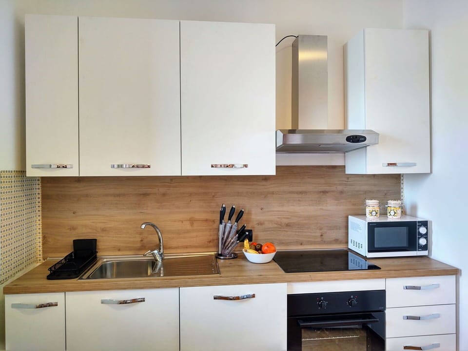 Furniture, Tableware, Table, Bottle, Building, Wood, Drinkware, Window, Chair, Flooring