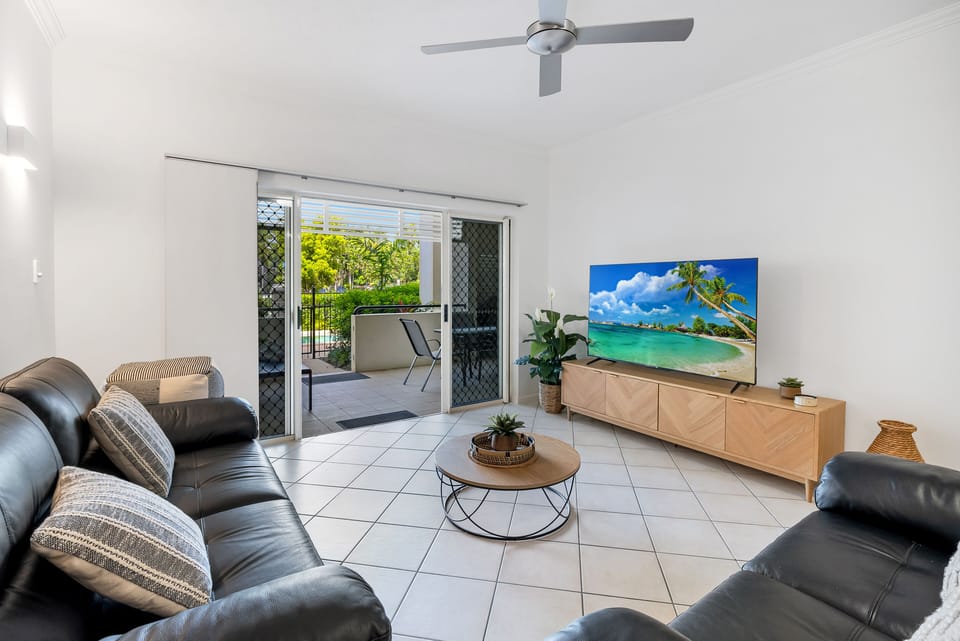 Comfort Apartment, 3 Bedrooms, Non Smoking, Poolside | Living area | 60-inch Smart TV with cable channels, Netflix, streaming services