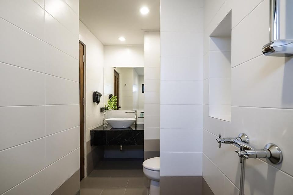 Shower, hair dryer, slippers, towels
